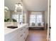 Elegant bathroom with double vanity, quartz countertop and soaking tub at 13130 Providence Rd, Milton, GA 30009