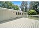 White wooden deck overlooks backyard, offering peaceful views at 13130 Providence Rd, Milton, GA 30009