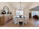 Bright dining room features a round table and sideboard at 13130 Providence Rd, Milton, GA 30009