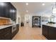 Long hallway with light hardwood floors and modern shelving at 13130 Providence Rd, Milton, GA 30009