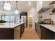 Spacious kitchen island with quartz countertops and breakfast bar at 13130 Providence Rd, Milton, GA 30009