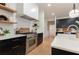 Modern kitchen features with gas range and white subway tile at 13130 Providence Rd, Milton, GA 30009