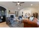 Living room with leather sofa and a stone fireplace at 13130 Providence Rd, Milton, GA 30009