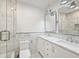 Elegant bathroom with double vanity, marble tile, and glass shower at 952 Lindbergh Ne Dr, Atlanta, GA 30324