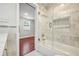 Bathroom featuring a tub, shower, and marble tiled walls at 952 Lindbergh Ne Dr, Atlanta, GA 30324