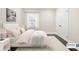 Cozy bedroom featuring a neutral color scheme, plush bedding, and natural light at 952 Lindbergh Ne Dr, Atlanta, GA 30324