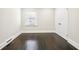 Simple bedroom with hardwood floors and double doors at 952 Lindbergh Ne Dr, Atlanta, GA 30324