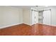 Bedroom featuring hardwood floors and double barn doors leading to a closet at 952 Lindbergh Ne Dr, Atlanta, GA 30324