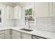 Clean kitchen with white cabinets, subway tile backsplash and stainless steel sink at 952 Lindbergh Ne Dr, Atlanta, GA 30324