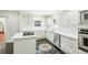 Modern kitchen featuring white cabinets, quartz countertops, and a center island at 952 Lindbergh Ne Dr, Atlanta, GA 30324