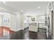 Modern kitchen with an island, white cabinets, and stainless steel fridge at 952 Lindbergh Ne Dr, Atlanta, GA 30324