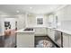 Modern kitchen with white cabinets, a center island, and dark hardwood floors at 952 Lindbergh Ne Dr, Atlanta, GA 30324