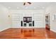 Bright living room featuring custom built-ins and hardwood floors at 952 Lindbergh Ne Dr, Atlanta, GA 30324