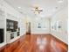 Spacious living room with hardwood floors, custom shelving, and lots of natural light at 952 Lindbergh Ne Dr, Atlanta, GA 30324