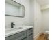 Modern basement bathroom with gray vanity and floating sink at 842 Laurelmont Sw Dr, Atlanta, GA 30311