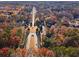 Aerial view of neighborhood showcasing tree-lined streets and homes at 3419 Concord Loop, Atlanta, GA 30349
