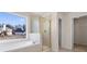 Bathroom with soaking tub, shower, and walk-in closet at 3419 Concord Loop, Atlanta, GA 30349