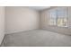 Bedroom with gray carpet and large window at 3419 Concord Loop, Atlanta, GA 30349
