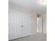 Bedroom with double door closet and carpet at 3419 Concord Loop, Atlanta, GA 30349