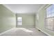 Spacious bedroom with carpet, neutral walls and large windows at 3419 Concord Loop, Atlanta, GA 30349