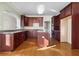 Kitchen with dark wood cabinets and a gas stove at 3419 Concord Loop, Atlanta, GA 30349