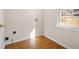 Laundry room with wood floors and a window at 3419 Concord Loop, Atlanta, GA 30349
