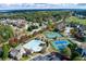Aerial view showcasing the community's amenities, including the pool, tennis courts, and playground at 108 Laurel Bay Se Dr, Loganville, GA 30052