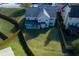Aerial view of a home's backyard with green grass and a covered patio, enclosed by a wood fence at 108 Laurel Bay Se Dr, Loganville, GA 30052