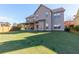 Spacious backyard with a covered patio, ideal for relaxing and enjoying the outdoors at 108 Laurel Bay Se Dr, Loganville, GA 30052