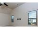 Bedroom with vaulted ceilings, fan and large windows providing plenty of natural light at 108 Laurel Bay Se Dr, Loganville, GA 30052