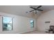 Bedroom with vaulted ceilings, a fan and multiple windows for natural light at 108 Laurel Bay Se Dr, Loganville, GA 30052