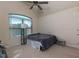 A bedroom with a large arched window and a ceiling fan at 108 Laurel Bay Se Dr, Loganville, GA 30052