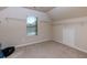 Walk-in closet with vaulted ceilings and lots of shelving perfect for storage at 108 Laurel Bay Se Dr, Loganville, GA 30052