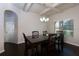 Dining room with dark wood floors, coffered ceiling, and view to the backyard at 108 Laurel Bay Se Dr, Loganville, GA 30052