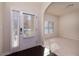 Inviting entryway with wood floors, sidelight windows, and neutral walls at 108 Laurel Bay Se Dr, Loganville, GA 30052