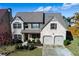 Beautiful two-story brick home with a manicured lawn and a two-car garage at 108 Laurel Bay Se Dr, Loganville, GA 30052