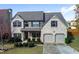 Charming two-story home with well-manicured lawn and two-car garage at 108 Laurel Bay Se Dr, Loganville, GA 30052
