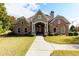 Charming brick home with a stately entrance, manicured lawn and professional landscaping at 108 Laurel Bay Se Dr, Loganville, GA 30052