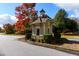 Neighborhood guard house with traditional details, professional landscaping, and tree-lined streets at 108 Laurel Bay Se Dr, Loganville, GA 30052