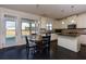Modern kitchen with stainless steel appliances and breakfast nook with natural light at 108 Laurel Bay Se Dr, Loganville, GA 30052