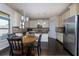 Modern kitchen with stainless steel appliances and breakfast nook with natural light at 108 Laurel Bay Se Dr, Loganville, GA 30052
