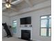 Spacious living room with coffered ceilings, fireplace, and abundant natural light at 108 Laurel Bay Se Dr, Loganville, GA 30052