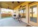 A covered patio featuring a grill, seating area, and views of the backyard at 108 Laurel Bay Se Dr, Loganville, GA 30052
