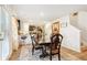 Dining room featuring a view of the kitchen, a dark wooden table, and outdoor access at 1363 Midnight Ride Ct, Hampton, GA 30228