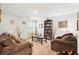 Inviting living room featuring cozy sofas, neutral tones, and ample seating space at 1363 Midnight Ride Ct, Hampton, GA 30228