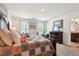 Inviting main bedroom boasting soft, natural light, a charming quilt, and a view into the bathroom at 1363 Midnight Ride Ct, Hampton, GA 30228