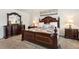 Elegant main bedroom with a beautiful bed, a dresser and nightstands at 1363 Midnight Ride Ct, Hampton, GA 30228