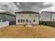View of the backyard showcasing a patio with a small seating area, perfect for outdoor relaxation at 7214 Gladstone Cir, Stonecrest, GA 30038