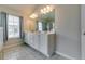 Bathroom with double sink vanity and neutral wall color, offering great natural light at 7214 Gladstone Cir, Stonecrest, GA 30038