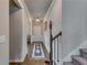 Hallway with hardwood floors, wainscoting, and staircase at 7214 Gladstone Cir, Stonecrest, GA 30038